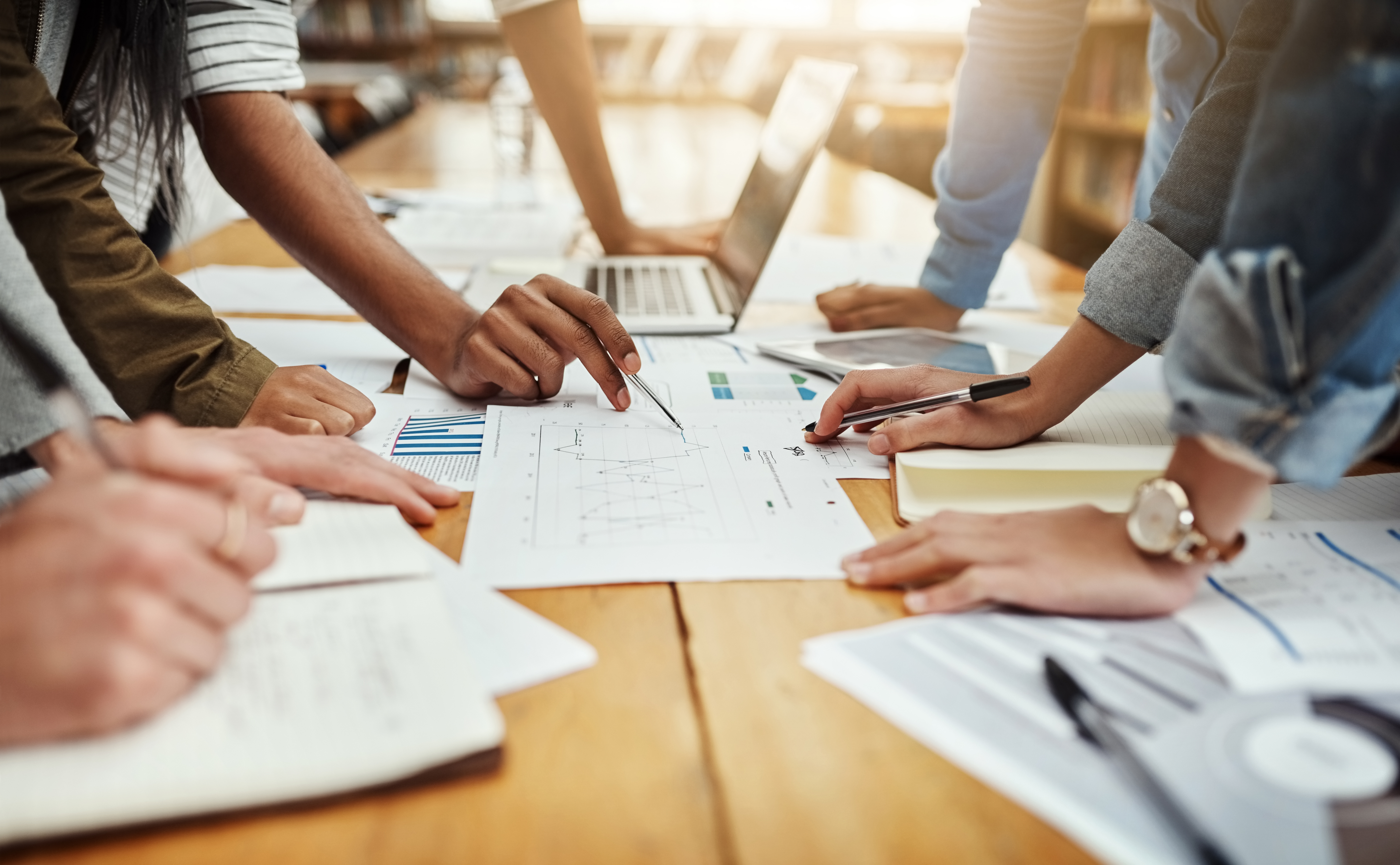 event professional reviewing annual conference budget graphs before a finance committee meeting